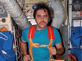 Mir-24 flight engineer Pavel Vinogradov exercises on the treadmill in the Mir space station Base Block.